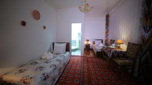 Katil atau katil-katil dalam bilik di Qutlug Qadam Guest House