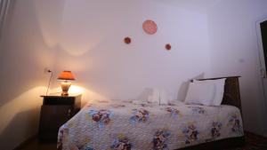 Katil atau katil-katil dalam bilik di Qutlug Qadam Guest House
