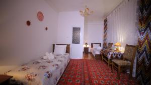 Katil atau katil-katil dalam bilik di Qutlug Qadam Guest House