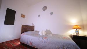 Katil atau katil-katil dalam bilik di Qutlug Qadam Guest House