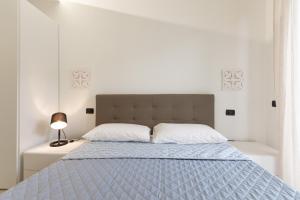 מיטה או מיטות בחדר ב-CASA AURORA