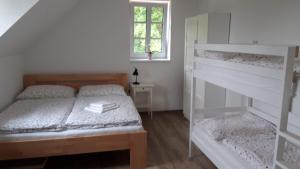 Postel nebo postele na pokoji v ubytování Penzion pod Čeřinkem + 31 fotografií