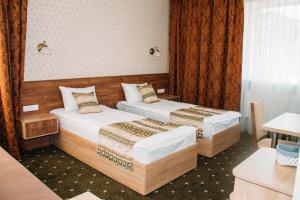 מיטה או מיטות בחדר ב-RioRo