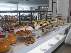 a buffet line with many different types of pastries at Hotel Nour Congress & Resort in Bizerte