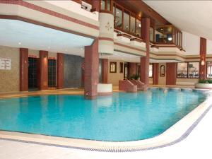 a large swimming pool in a hotel lobby at Whitewater Hotel & Spa in Newby Bridge +33 photos