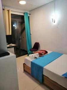 Postel nebo postele na pokoji v ubytování Residence Les Bambous B&B