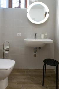 a bathroom with a sink and a mirror on the wall at Casa Concerie Due in Sulmona