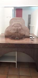 a table with a stone mixer on top of it at Domaine Xixtaberri in Cambo-les-Bains