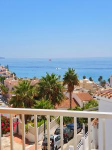 a view of the ocean from a balcony at MB Hostels Premium ECO - Adults Recommended in Nerja