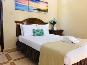 Postel nebo postele na pokoji v ubytování Arecibo Inn + 37 fotografií