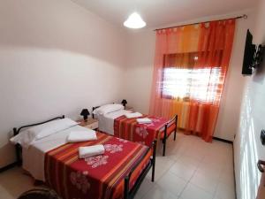 Posteľ alebo postele v izbe v ubytovaní Bed and breakfast lagiocosa