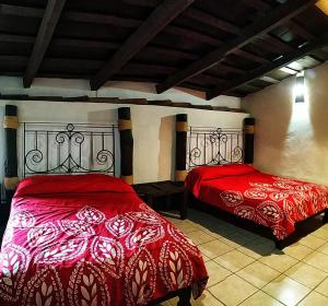 Postel nebo postele na pokoji v ubytování La Casona De La Esmeralda