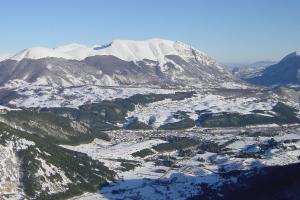 an aerial view of a snow covered mountain at Hotel Garnì Posta in Pescasseroli