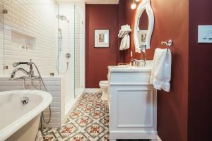 a bathroom with a tub and a sink and a toilet at Mansion on Sutter in San Francisco