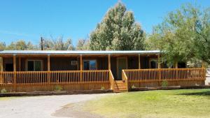 a large wooden fence with a train on top of it at Shoshone Inn in Shoshone
