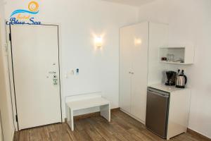 Kuchyň nebo kuchyňský kout v ubytování Blue Sea Hotel