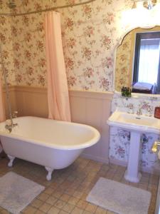 a bathroom with a tub and a sink at Pescadero Creek Inn in Pescadero