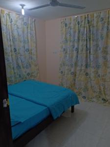 Postel nebo postele na pokoji v ubytování Homestay pekan ranau