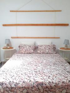 Łóżko lub łóżka w pokoju w obiekcie Los Ancones Apartment