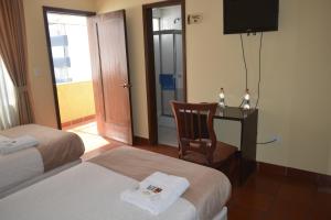 Letto o letti in una camera di Hotel Casa Kolping Quito
