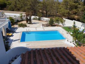 an overhead view of a swimming pool on a house at OceanOasis Residences Suites in Olhão