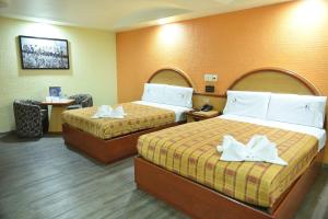 Säng eller sängar i ett rum på Hotel Atizapan