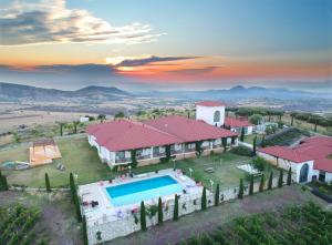 an aerial view of a house with a swimming pool at Villa Estet Bağ Hotel in Kula