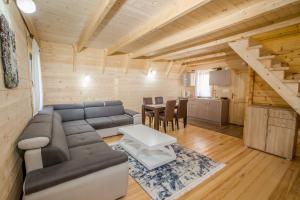 a living room with a couch and a table at Paradise Zabljak in Žabljak