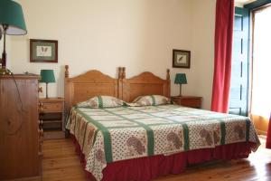 Postel nebo postele na pokoji v ubytování Casa da Arvore