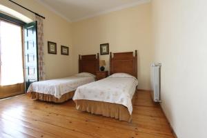 Postel nebo postele na pokoji v ubytování Casa da Arvore
