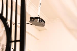 a camera hanging from a ceiling in a room at XiNing Chengxi ·Limeng Pedestrian Street· in Xining