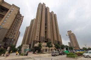 a group of tall buildings in a city at Baoding Lianchi·Baoding East Station· Locals Apartment 00163450 in Baoding