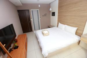 Postel nebo postele na pokoji v ubytování Mayu Hotel