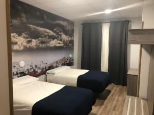 Posteľ alebo postele v izbe v ubytovaní Hostel El Paloma