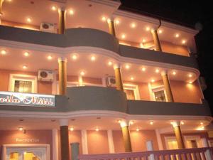 a large building with lights on top of it at HOTEL VILA MITIC LUXX SPA centar in Leskovac