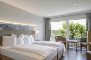 Postel nebo postele na pokoji v ubytování Hotel Rebenhof