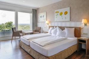 Postel nebo postele na pokoji v ubytování Hotel Rebenhof