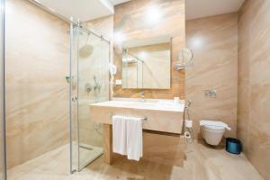 a bathroom with a sink and a shower at City Park Hotel in Baku