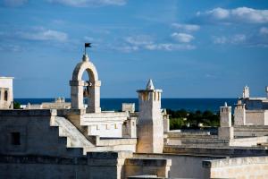 a building with a flag on top of it at Borgo Egnazia in Savelletri di Fasano