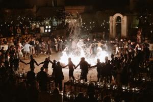 a group of people dancing in front of a crowd at Borgo Egnazia in Savelletri di Fasano