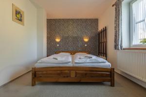 Postel nebo postele na pokoji v ubytování Penzion Na Bobrovníku