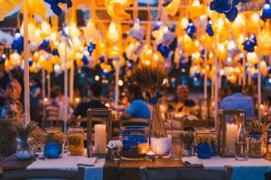 a table with candles and flowers in jars and lights at Borgo Egnazia in Savelletri di Fasano