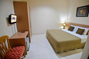 Postel nebo postele na pokoji v ubytování Hotel Graha DPT 33