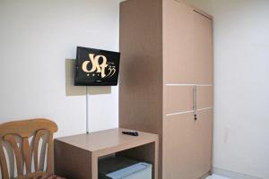 TV a/nebo společenská místnost v ubytování Hotel Graha DPT 33