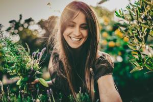 a woman smiling in a field of flowers at Borgo Egnazia in Savelletri di Fasano