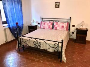 Postel nebo postele na pokoji v ubytování Agriturismo podere Casano