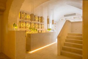 a hallway with a staircase in a building at Borgo Egnazia in Savelletri di Fasano