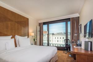 Postel nebo postele na pokoji v ubytování Warwick Geneva