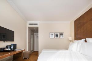 Postel nebo postele na pokoji v ubytování Warwick Geneva