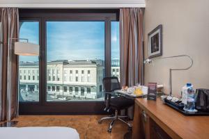 Postel nebo postele na pokoji v ubytování Warwick Geneva